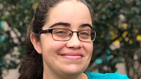 An artist with Disney named Maria Stuckey smiling for a photo