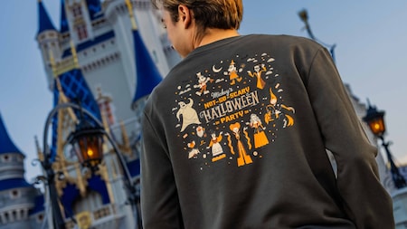 Back view of a dark sweatshirt with Halloween artwork featuring Mickey Mouse, Minnie Mouse, Oogie Boogie, the Headless Horseman, and the Sanderson Sisters, with text reading “Mickey’s Not‑So‑Scary Halloween Party 2026. "