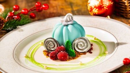 A dessert cake resembling Cinderella’s pumpkin carriage