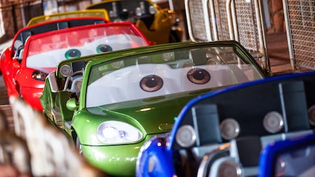 Cars lined up at the boarding station of Radiator Springs Racers