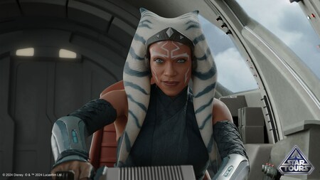 Ahsoka Tano at the helm of a ship with a Star Tours icon
