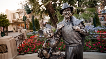 A statue of Walt Disney with Mickey Mouse, located on Buena Vista Street in Disney California Adventure Park
