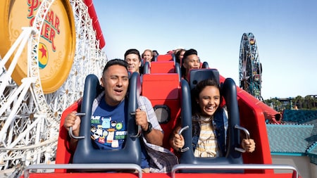 Guests ride the Incredicoaster roller coaster at Disney California Adventure Park