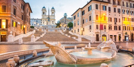 The Fontant della Barcaccia at the base of the Spanish Steps and the Trinita dei Monti church The Fontant della Barcaccia at the base of the Spanish Steps and the Trinita dei Monti church