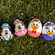 Disney themed eggs rest on grass including Chip and Dale, Mickey and Minnie Mouse and Donald and Daisy Duck