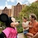 Mickey Mouse interacting with a parent and child at Aulani, A Disney Resort & Spa