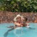 A couple in Wailana Pool at Aulani, A Disney Resort & Spa