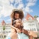 Child and parent in front of Disney's Grand Floridian Resort & Spa