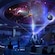 Une illustration de visiteurs à Guardians of the Galaxy Galaxarium, où un Star Blaster bondit d’un portail   