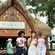 Three Guests enjoying food and drinks at the Hawaii booth during the Epcot International Food & Wine Festival