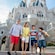 A family of four in front of Cinderella's castle