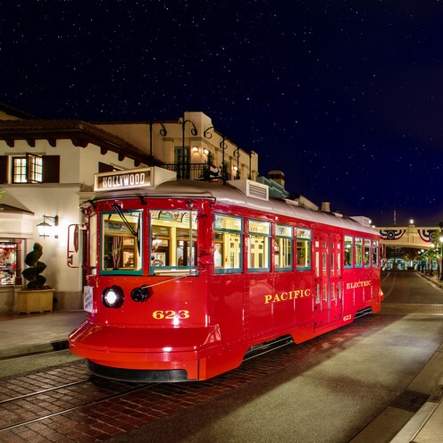 A trolley car on Buena Vista Street at night