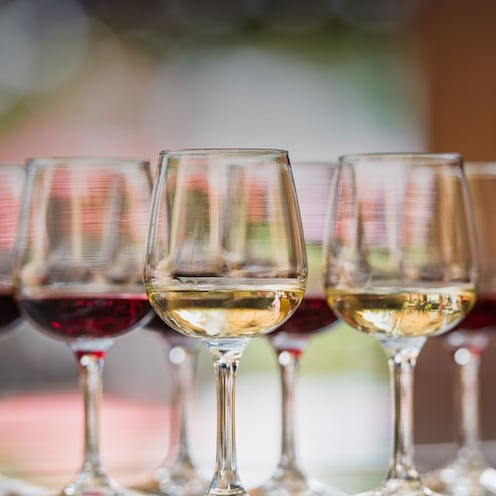 8 wine glasses, each with either red or white wine