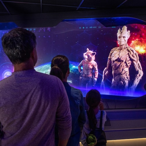 Guests receive a mission brief from Rocket and Groot during Guardians of the Galaxy Cosmic Rewind at Epcot