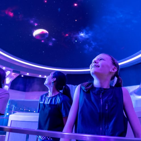 Guests admire the queue for Guardians of the Galaxy: Galactic Rewind in EPCOT