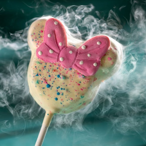 The Liquid Nitrogen Minnie Cake Pop surrounded by liquid nitrogen vapor