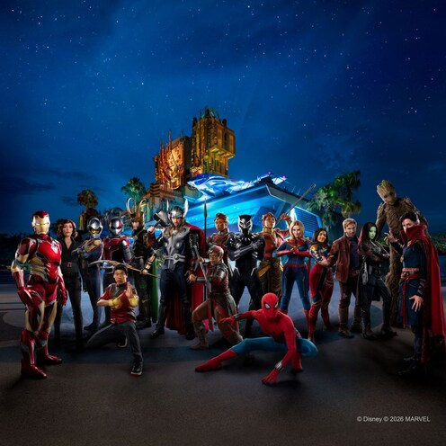 A group of Marvel characters standing in front of Avengers Headquarters