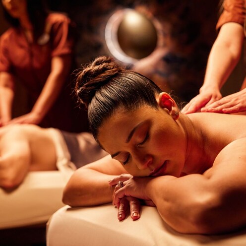A couple enjoying a relaxing back massage at Tenaya Stone Spa.