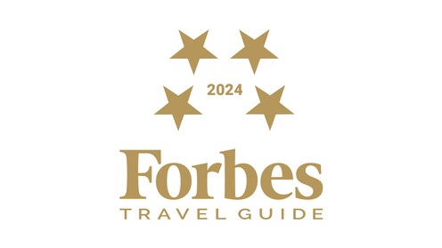 Un ícono de la clasificación de cuatro estrellas de Forbes Travel Guide 2024