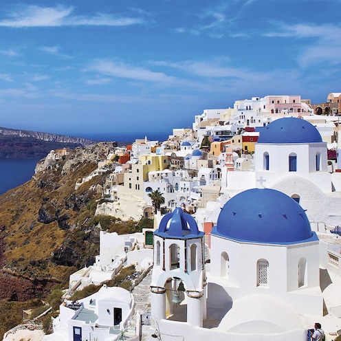 Bask in the tranquility and blue domes of Santorini