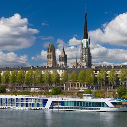 The AmaLyra ship sails past Rouen, France along the Seine River The AmaLyra ship sails past Rouen, France along the Seine River