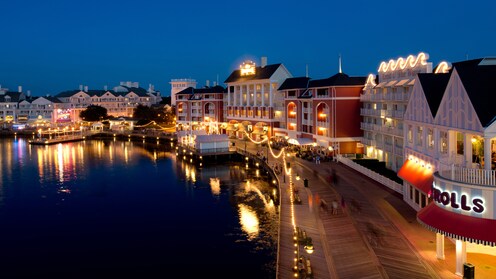 The waterfront area at Disney’s BoardWalk Inn illuminated at night