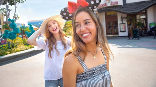 2 women walking through a courtyard in the Downtown Disney District