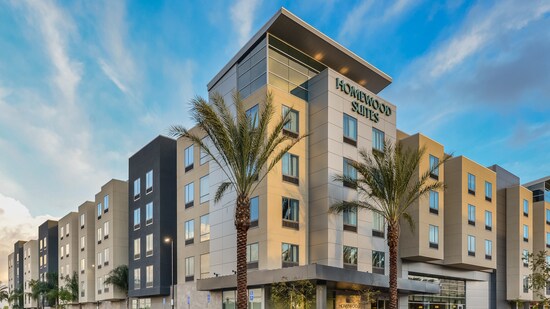 Palm trees flank the entrance to the Homewood Suites hotel in Anaheim, California