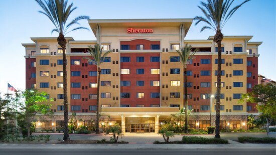 The outside of the Sheraton Garden Grove, Anaheim South Hotel at dusk