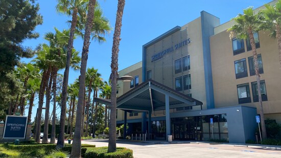 With palm trees lining the entrance, the modern style SpringHill Suites by Marriott Anaheim Maingate.