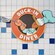 Two service windows flank a Duck In Diner sign featuring Donald Duck with a spatula
