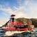 A captain piloting a semi submersible boat next to an island