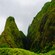 A lush peak situated next to a verdant mountainside