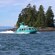 In Alaska, an enclosed boat traveling along the sea