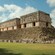 An ancient Mayan ruin decorated with geometric shapes in its stonework