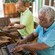 A man rolling cigars