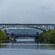 2 bridges over a bay surrounded by verdant mountains