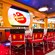 Mickey themed chairs and scenes from popular Disney films adorn the walls at Animators Palate restaurant
