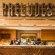 A sign says Preludes over a quick service restaurant bar with snacks on the counter and beverages behind it