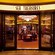 A lit art deco sign identifies Sea Treasures, a store