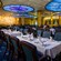 The elegant dining room at Tritons restaurant with a dazzling ocean liner and Art Deco theme