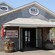 Building exterior with signs that say BEALS, LOBSTER PIER, Since 1932 and LOBSTERS, LIVE AND BOILED, EAT IN OR TAKE OUT, FULL MENU AVAILABLE