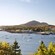 Hills bordering a body of water featuring boats
