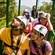 Aerial tram passengers look at trees