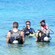 A scuba instructor briefs Guests in the water before a dive