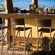 An outdoor bar provides views to the ocean