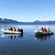 The Princess Tiana Character and other costumed performers with props engaged in a New Orleans style celebration