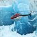 A helicopter flying alongside a glacier