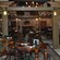 A pub dining room furnished with antique wooden tables and chairs