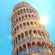 The sun shines brightly behind the Leaning Tower of Pisa